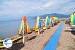 Parasols and ligbedden at beach of Skala Kallonis - Photo GreeceGuide.co.uk