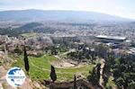 The oude theater of Dionysos - On the right the Acropolis museum - Photo GreeceGuide.co.uk